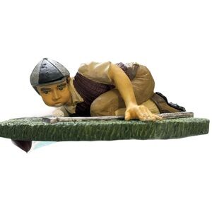 Charming Figurine of a Boy in Brown and Green